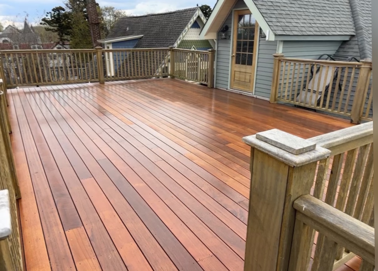 Angled view of the finished mahogany deck looking toward the cottage door