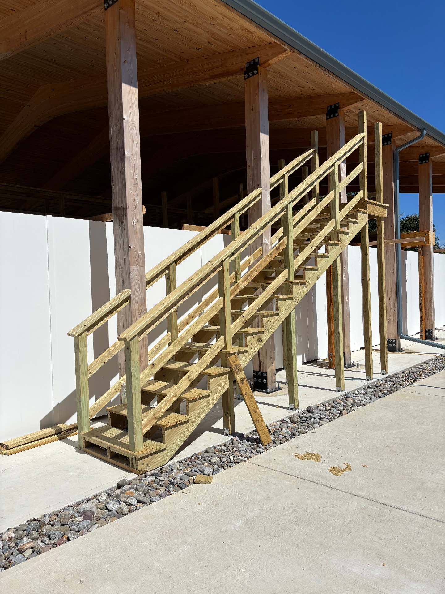Custom pressure-treated timber staircase leading up to the pavilion deck
